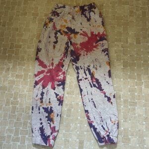 Adika pink, white, and orange sweatpants.